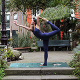 green, turquoise yoga mat, dancer pose